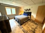 Lower level bedroom 5 with queen bed